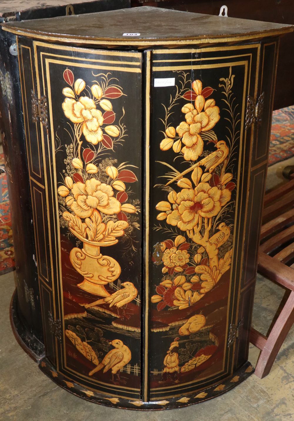 A bow fronted lacquer hanging corner cabinet, W.60cm, D.40cm, H.92cm